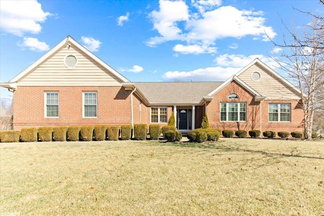 ranch-style home with brick siding and a front yard