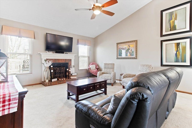 living area with light carpet, vaulted ceiling, a brick fireplace, and baseboards