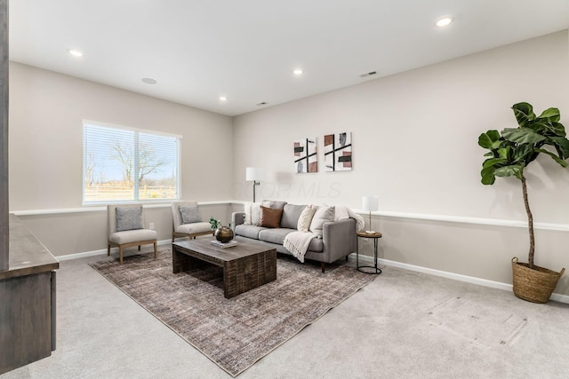 living room with recessed lighting, light carpet, and visible vents