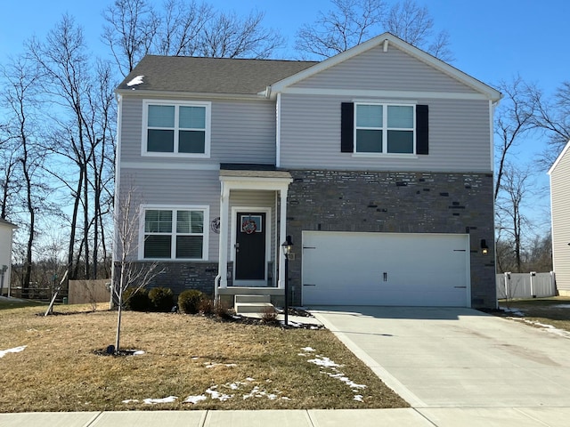 view of front of home with concrete driveway, fence, a garage, and stone siding