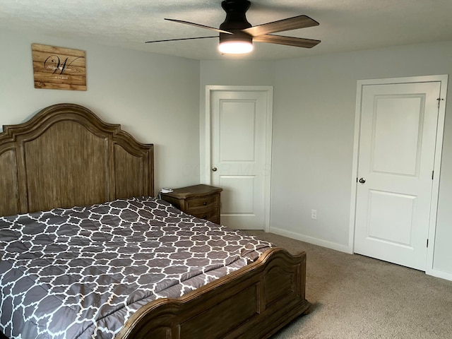 bedroom with baseboards, ceiling fan, and light colored carpet