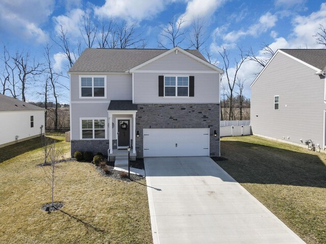 view of front of property featuring driveway, a front yard, an attached garage, and fence