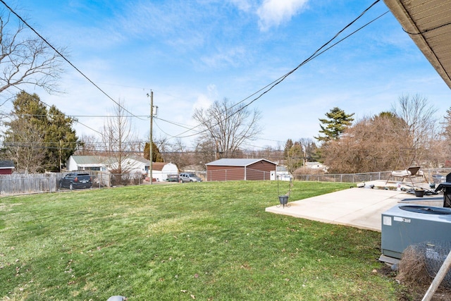 view of yard featuring a patio area, fence, and cooling unit