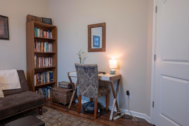 home office featuring baseboards and wood finished floors