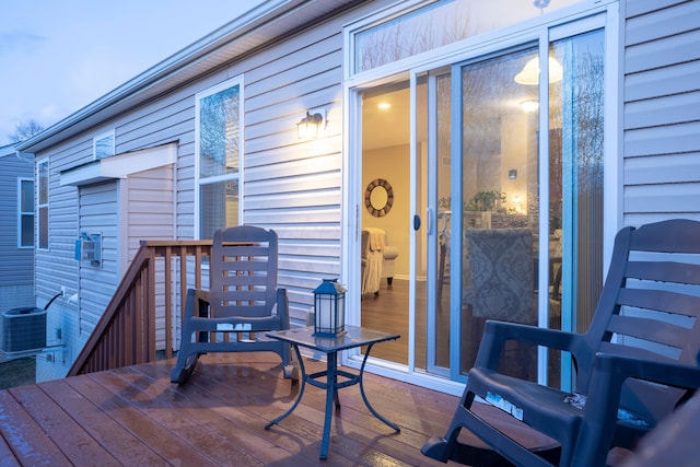 wooden terrace featuring central air condition unit