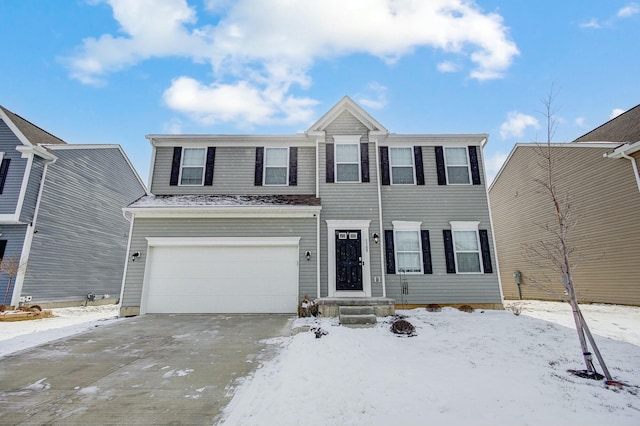 view of front of house with a garage and concrete driveway