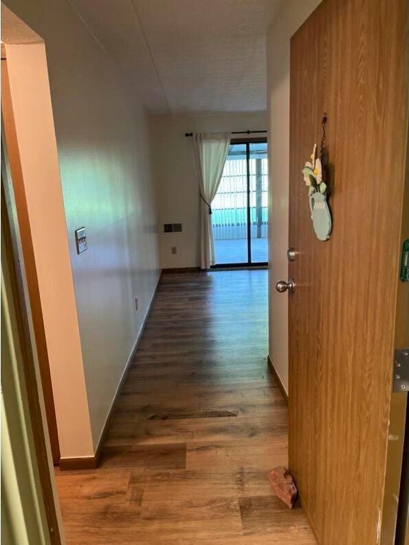 5885 Beechcroft Rd Unit 110, Columbus, OH 43229 - corridor featuring wood finished floors and baseboards