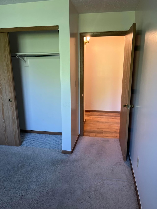 5885 Beechcroft Rd Unit 110, Columbus, OH 43229 - unfurnished bedroom featuring carpet, a closet, and baseboards