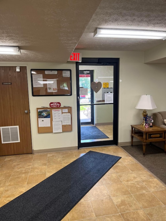 5885 Beechcroft Rd Unit 110, Columbus, OH 43229 - lobby featuring a textured ceiling