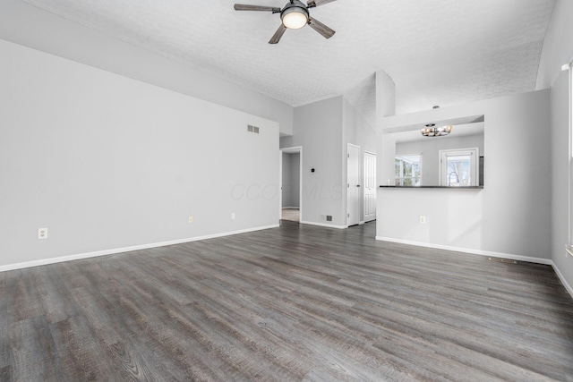 unfurnished living room with dark wood-style floors, visible vents, a ceiling fan, a textured ceiling, and baseboards