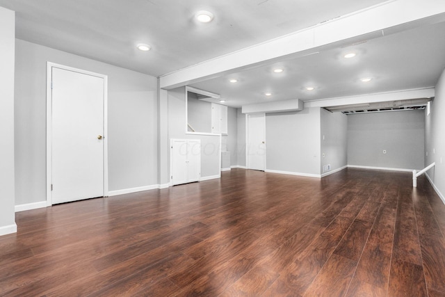 finished basement with baseboards, wood finished floors, and recessed lighting