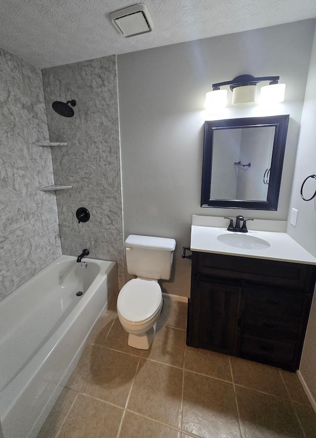 bathroom featuring a textured ceiling, toilet, bathing tub / shower combination, vanity, and baseboards