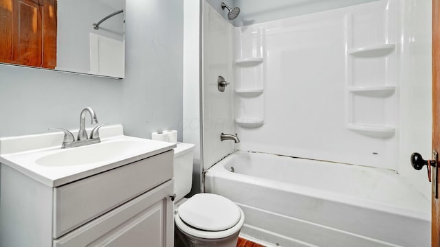 bathroom with toilet, shower / washtub combination, and vanity