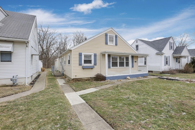 bungalow-style house with covered porch and a front yard