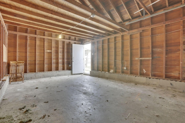 misc room with concrete flooring