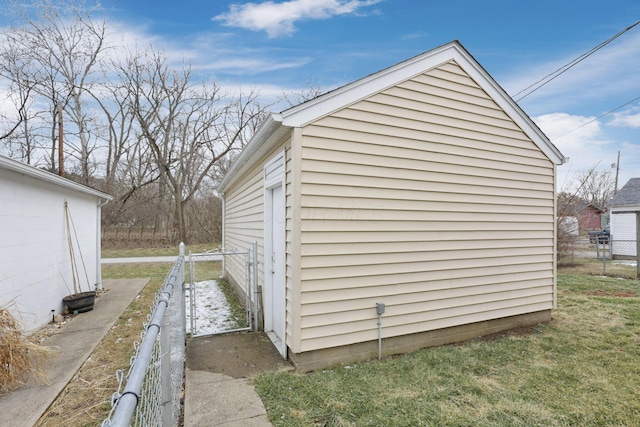 view of outbuilding with fence