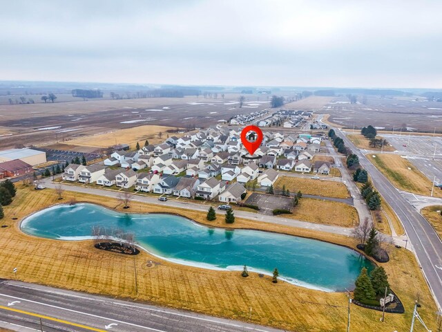 birds eye view of property with a residential view