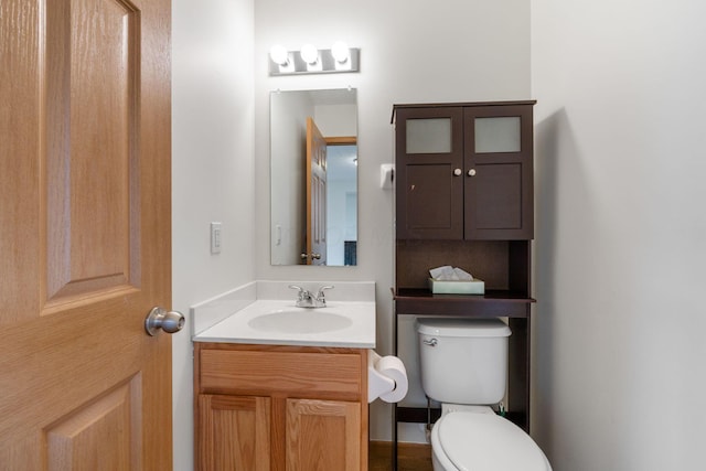 half bath with vanity and toilet