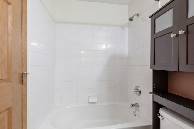 bathroom featuring bathing tub / shower combination and toilet