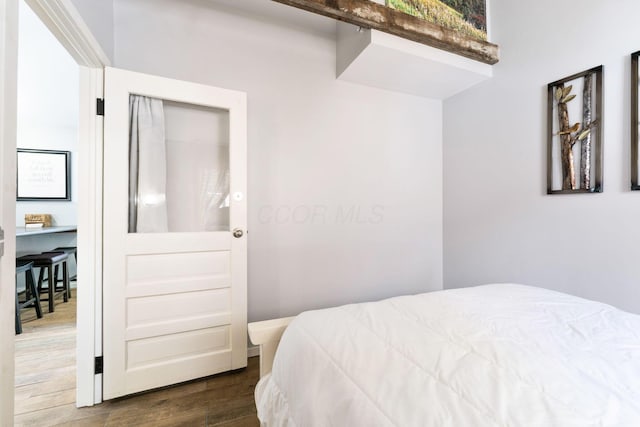 bedroom with wood finished floors