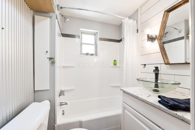 full bath featuring shower / tub combo, vanity, and toilet