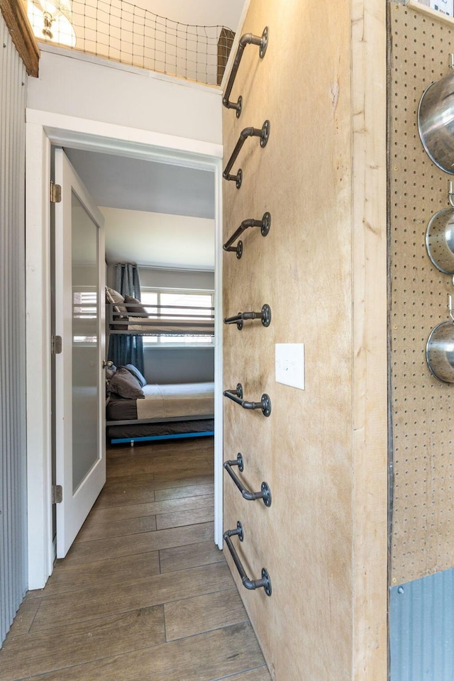 interior space featuring walk in shower and wood finished floors