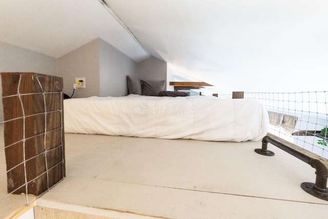 bedroom featuring lofted ceiling