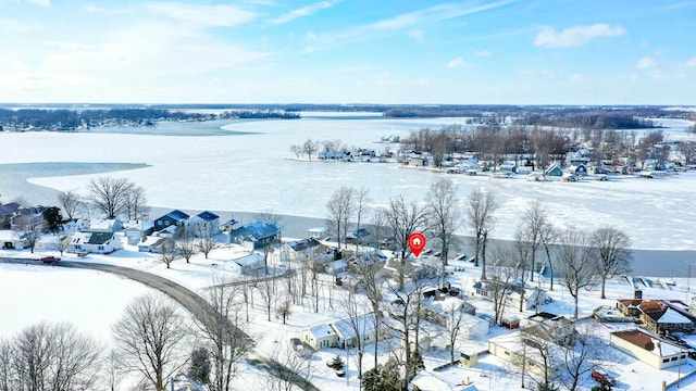 snowy aerial view featuring a residential view