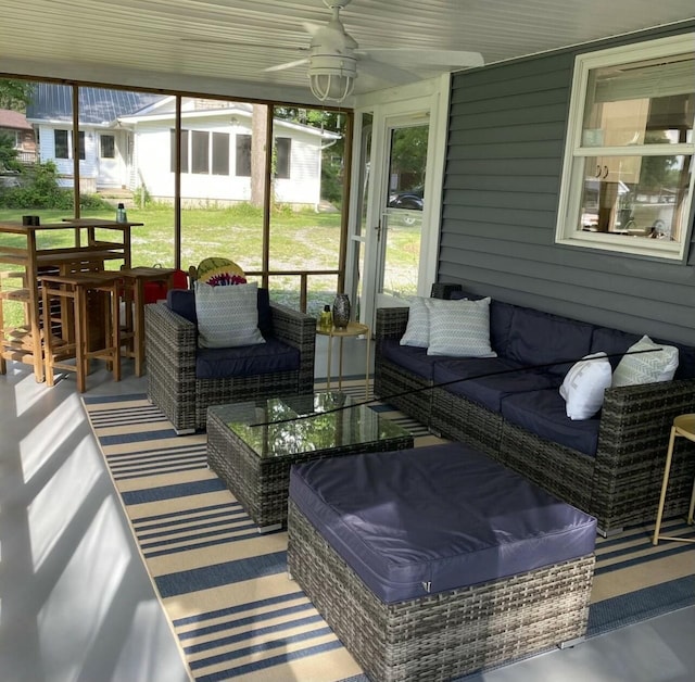 sunroom with a ceiling fan