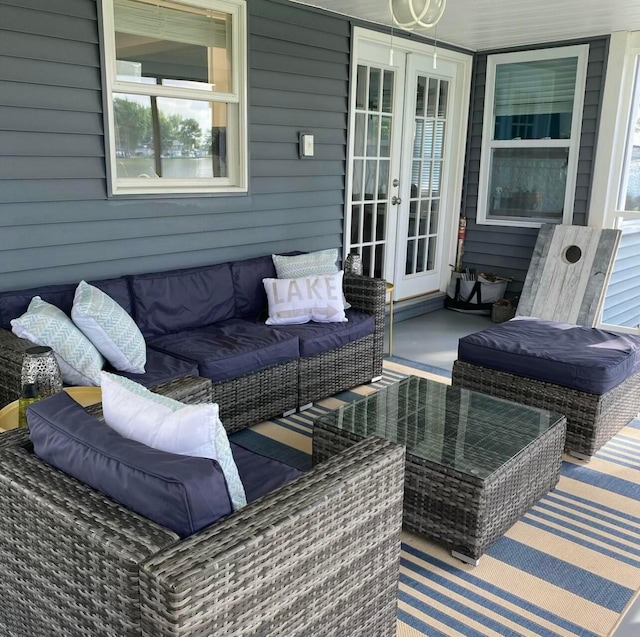 view of patio / terrace with french doors and an outdoor living space