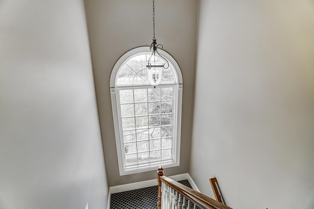 stairway featuring baseboards