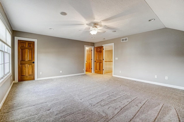 unfurnished room featuring light carpet, ceiling fan, visible vents, and baseboards