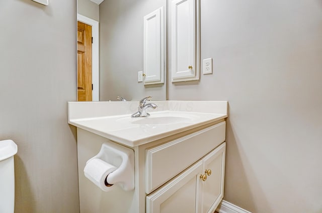 half bath with vanity and toilet