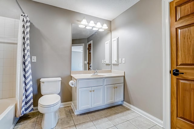 bathroom featuring toilet, vanity, baseboards, tile patterned floors, and shower / tub combo with curtain