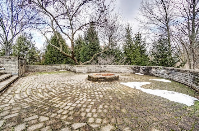 view of patio with an outdoor fire pit