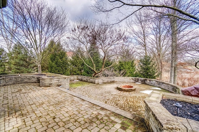 view of patio / terrace with a fire pit