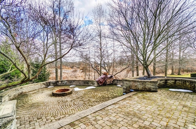 view of patio with a fire pit