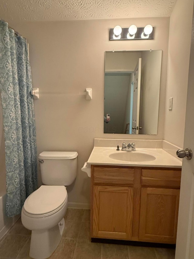 bathroom with toilet, vanity, tile patterned flooring, shower / bath combination with curtain, and a textured ceiling