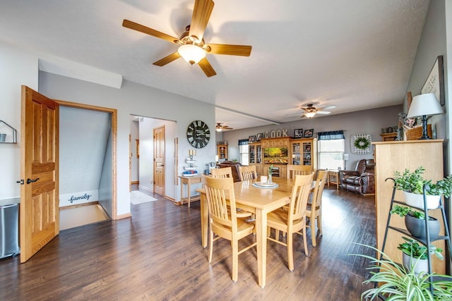 dining room featuring dark wood-style floors and ceiling fan