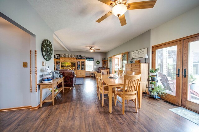 dining space featuring dark wood-style floors, french doors, a ceiling fan, a textured ceiling, and baseboards