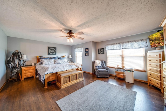 bedroom featuring dark wood-type flooring, multiple windows, and a ceiling fan