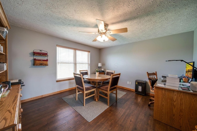 dining area with baseboards, dark wood finished floors, and a ceiling fan