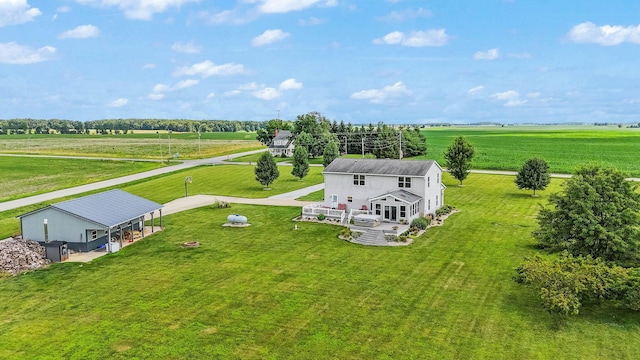 birds eye view of property with a rural view