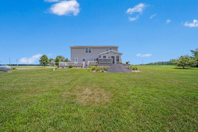 back of property featuring a lawn