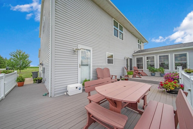 wooden deck featuring outdoor dining space