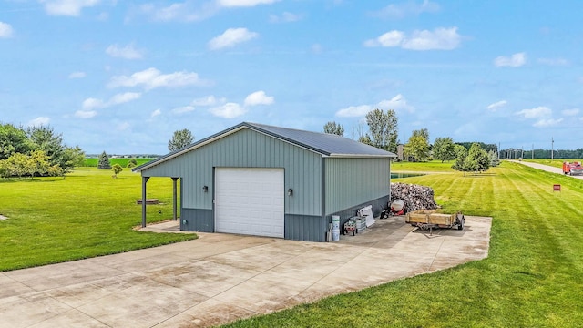 view of outbuilding with concrete driveway and an outdoor structure