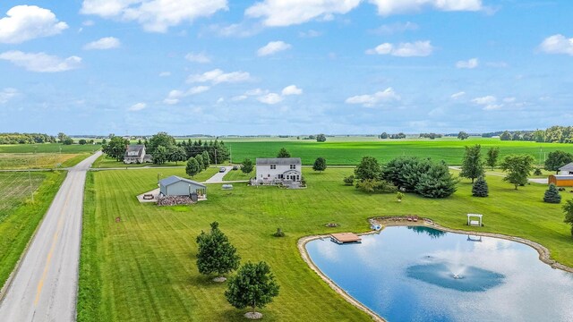 birds eye view of property featuring a water view and a rural view