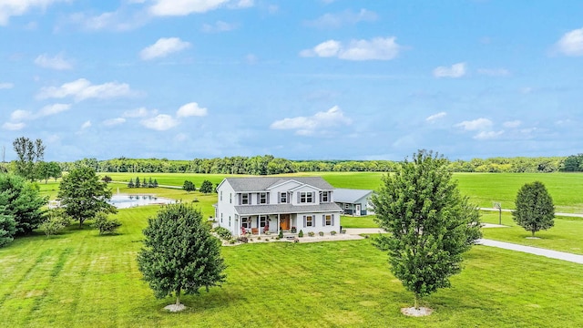 exterior space with a porch, a front yard, and a rural view