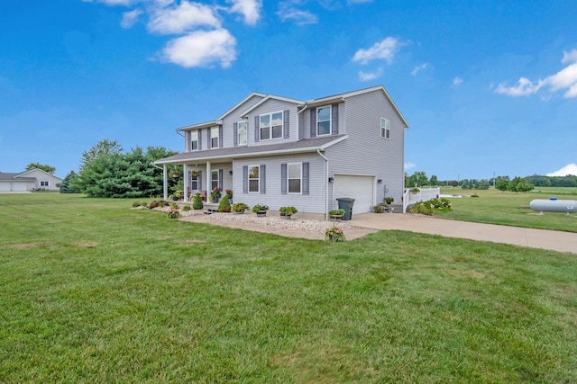 view of front of home featuring an attached garage, covered porch, driveway, and a front lawn