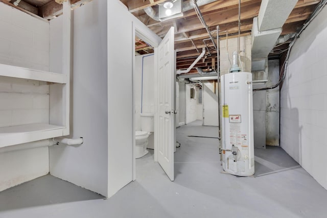 unfinished basement with concrete block wall and water heater